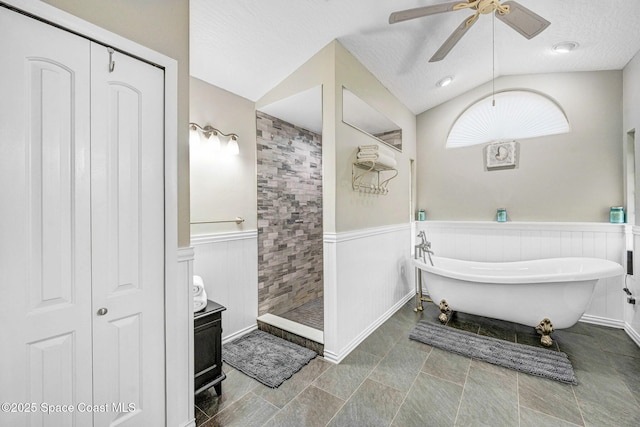 bathroom featuring lofted ceiling, ceiling fan, independent shower and bath, a textured ceiling, and vanity