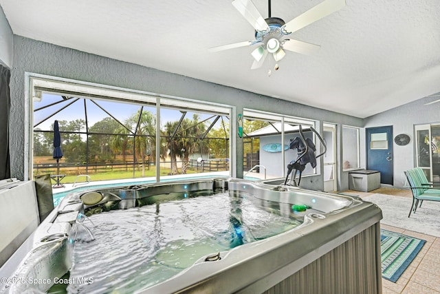 sunroom with a hot tub