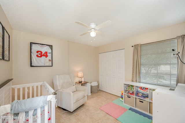 bedroom featuring ceiling fan and a closet