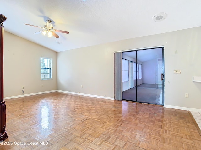 unfurnished room featuring ceiling fan, lofted ceiling, and light parquet floors