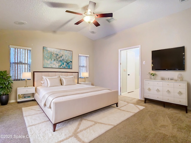 carpeted bedroom with ceiling fan and lofted ceiling