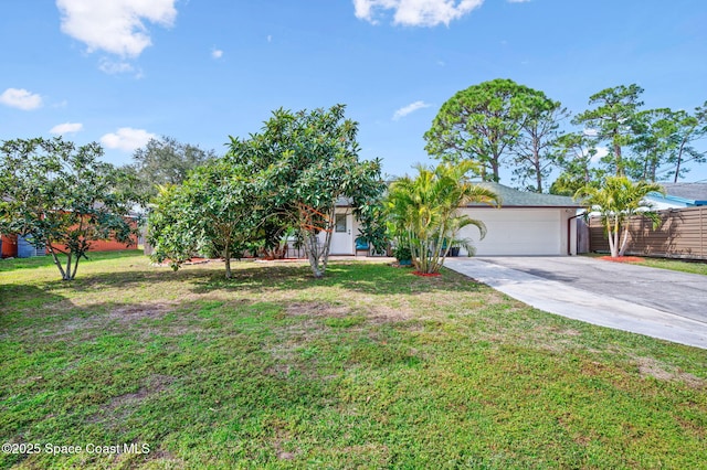 view of front of house with a garage and a front yard