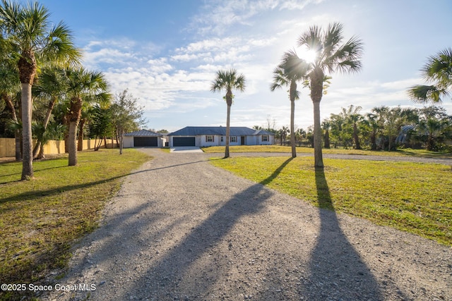 ranch-style home featuring a front yard