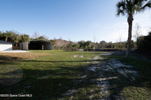 view of yard with a carport