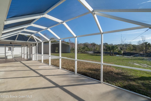 unfurnished sunroom with lofted ceiling