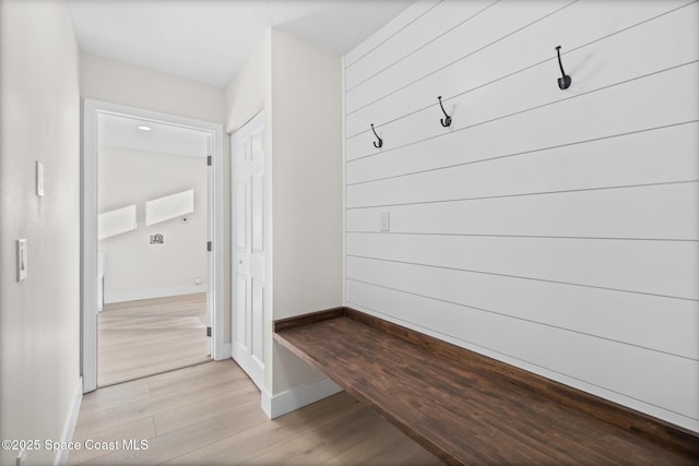 mudroom with light hardwood / wood-style floors