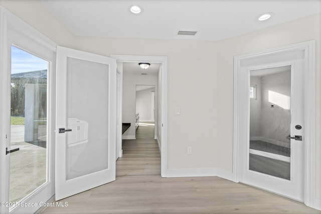 hallway featuring light hardwood / wood-style floors