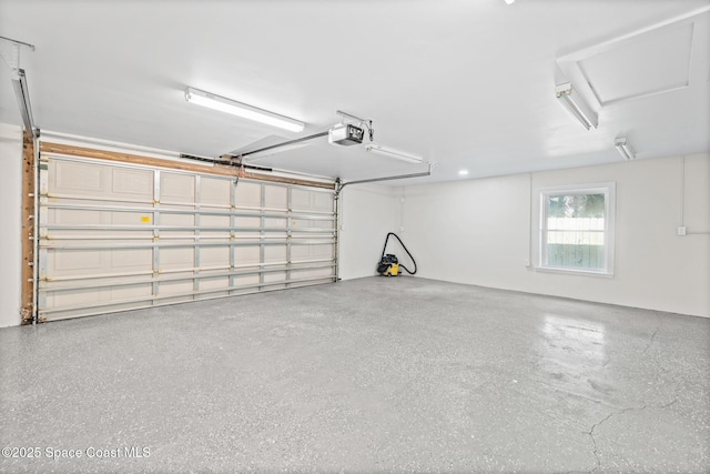 garage featuring a garage door opener