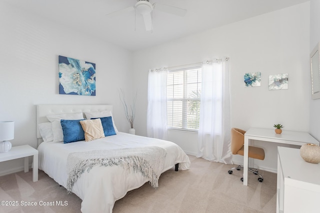 bedroom featuring ceiling fan and light colored carpet