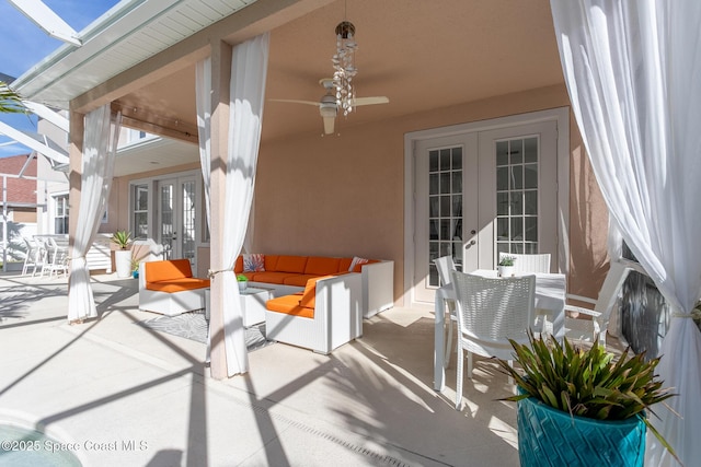 view of patio featuring ceiling fan and french doors