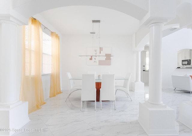 dining area with ornate columns