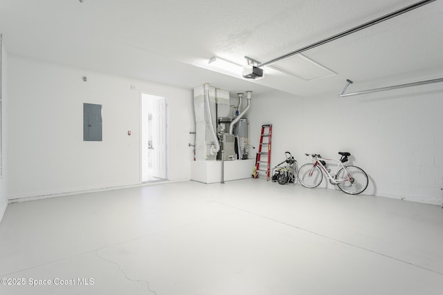 garage featuring a garage door opener, heating unit, and electric panel