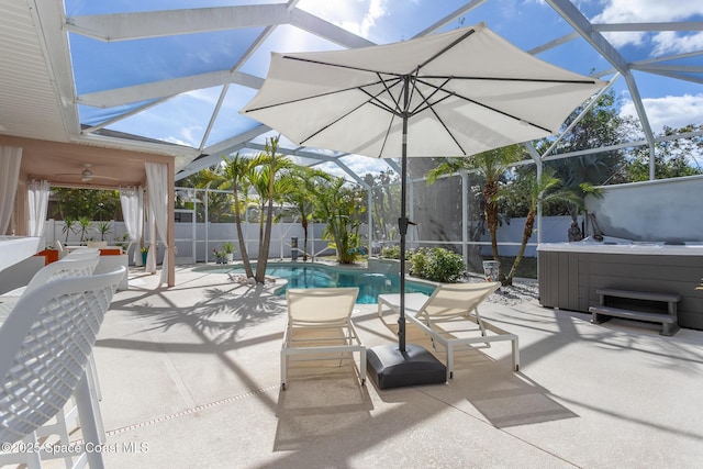 view of patio / terrace featuring a pool with hot tub and glass enclosure