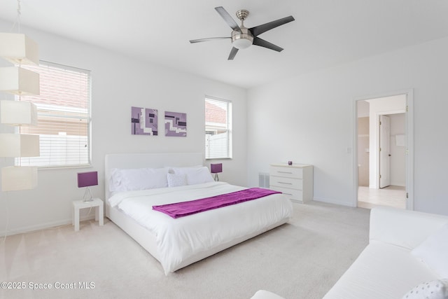 bedroom featuring light carpet and ceiling fan