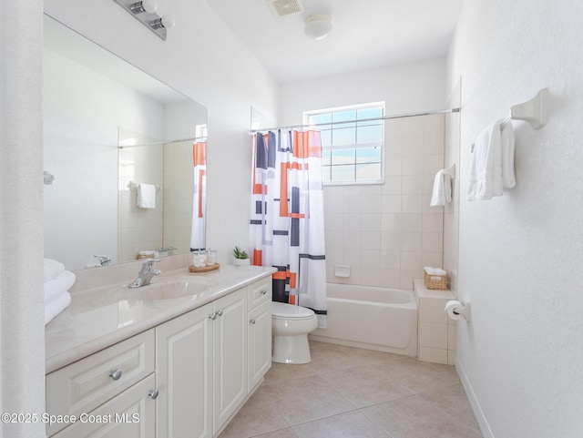 full bathroom featuring vanity, toilet, tile patterned flooring, and shower / bath combo