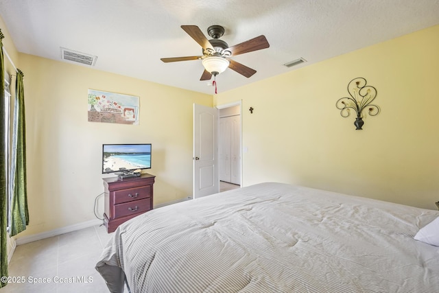 bedroom featuring light tile patterned floors and ceiling fan