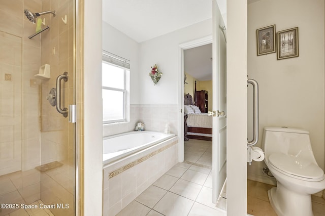 bathroom with toilet, independent shower and bath, and tile patterned flooring