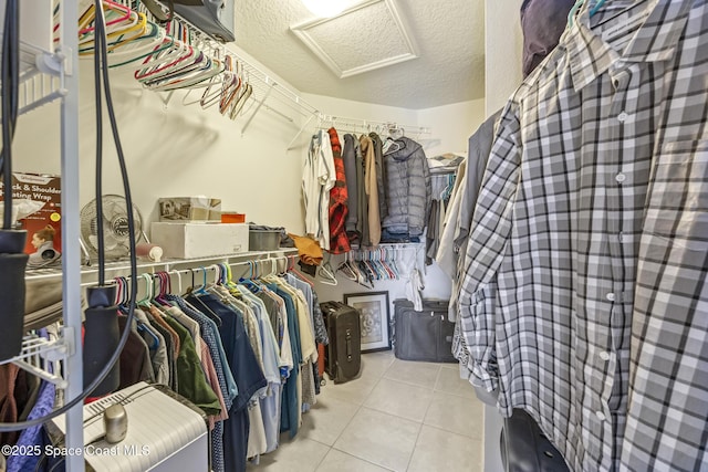 walk in closet featuring light tile patterned floors