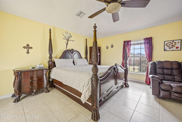 tiled bedroom featuring ceiling fan