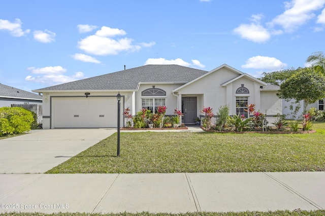 ranch-style home featuring a garage and a front lawn