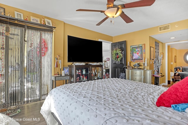 bedroom with ceiling fan, hardwood / wood-style floors, and access to outside