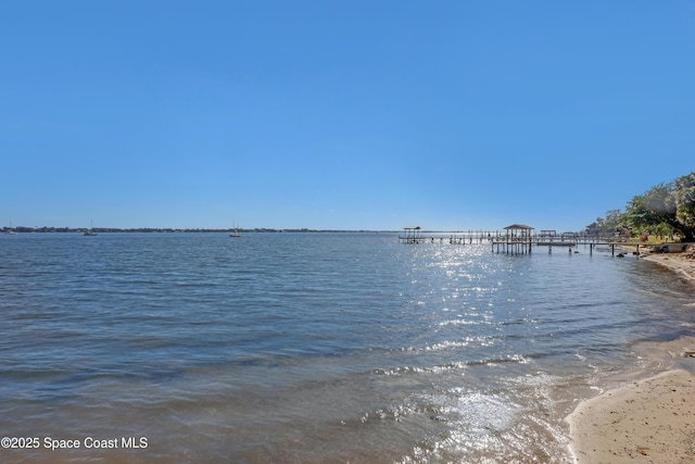 water view featuring a boat dock and a view of the beach