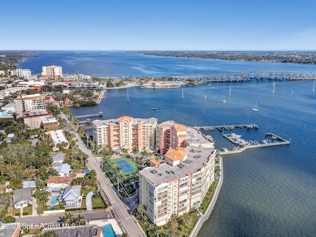 birds eye view of property with a water view