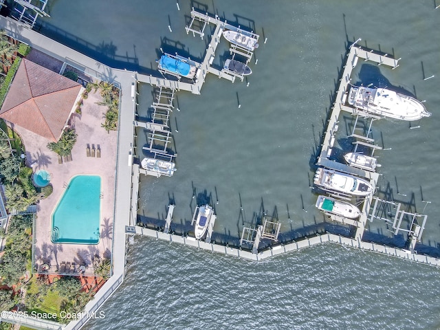 birds eye view of property with a water view