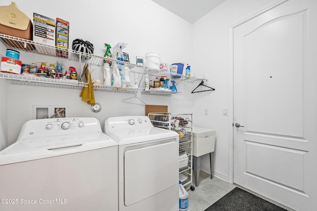 washroom featuring washer and clothes dryer