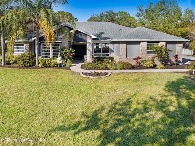 view of front of home with a garage and a front lawn