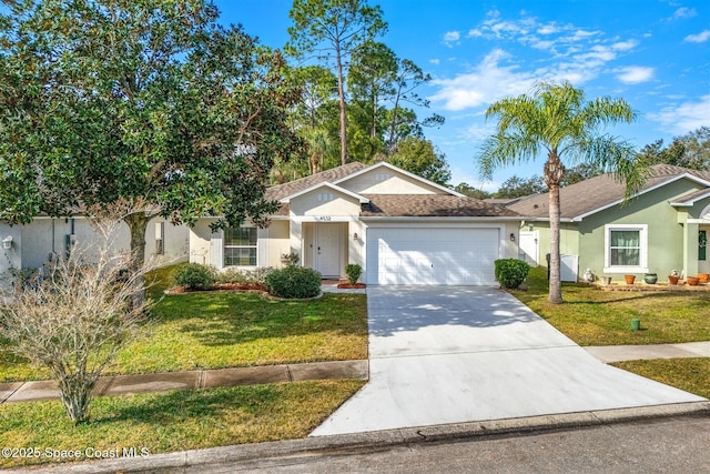 ranch-style home with a garage and a front lawn