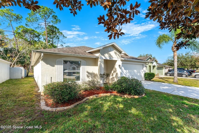 view of front of property featuring a garage and a front yard