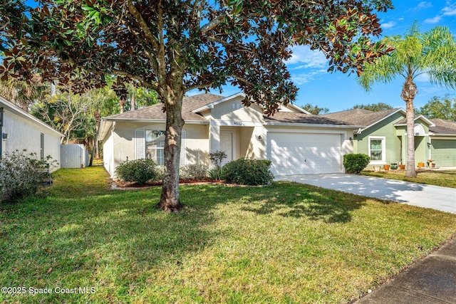 ranch-style home featuring a garage and a front lawn