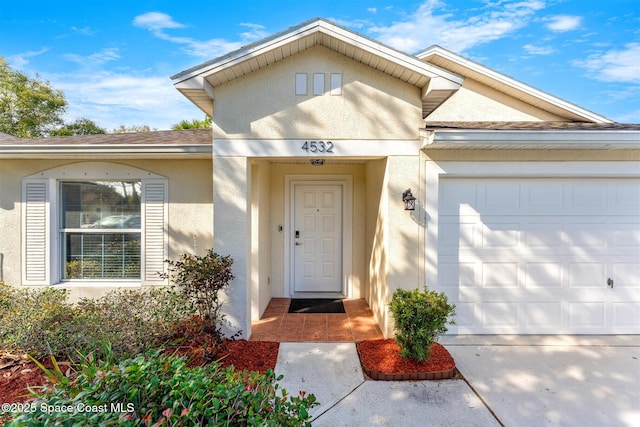 entrance to property featuring a garage