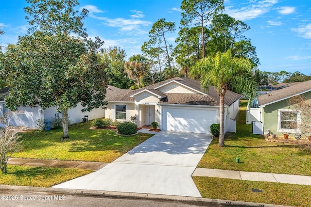 view of front facade with a garage and a front yard