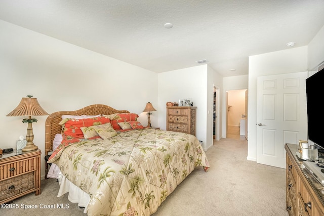 bedroom featuring light carpet