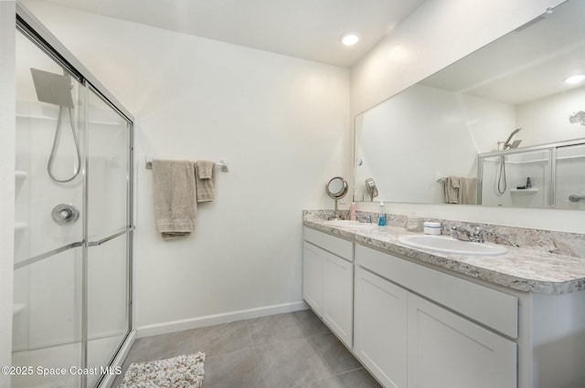 bathroom featuring vanity, tile patterned flooring, and a shower with door