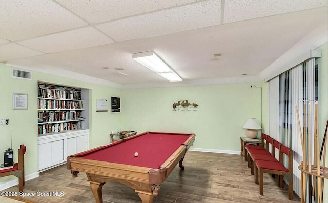 game room featuring hardwood / wood-style floors, a paneled ceiling, and billiards