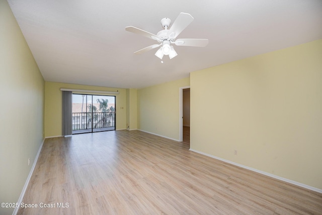 empty room featuring ceiling fan and light hardwood / wood-style flooring