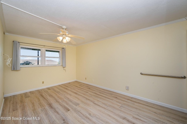 unfurnished room with ceiling fan, ornamental molding, light hardwood / wood-style flooring, and a textured ceiling