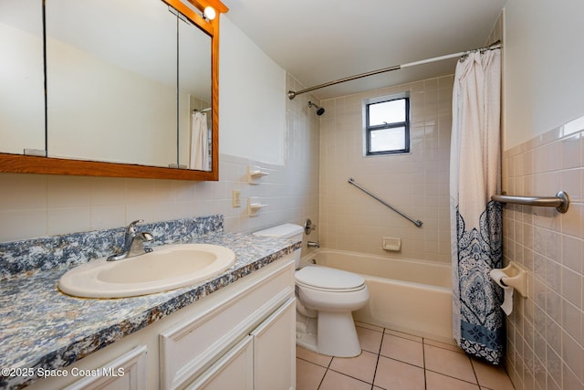 full bathroom featuring tile walls, tile patterned flooring, shower / tub combo, vanity, and toilet