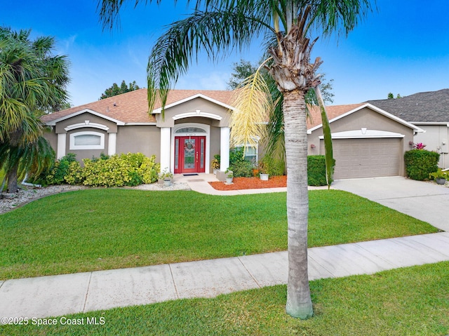 single story home featuring a garage and a front lawn