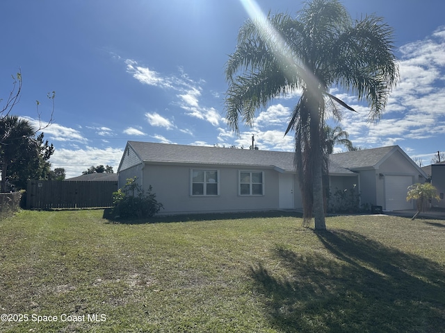 view of property exterior with a garage and a yard