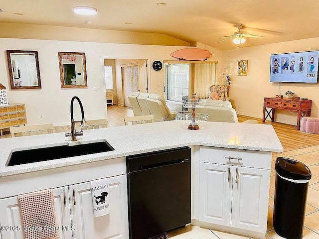 kitchen featuring white cabinetry, dishwasher, sink, ceiling fan, and light hardwood / wood-style floors