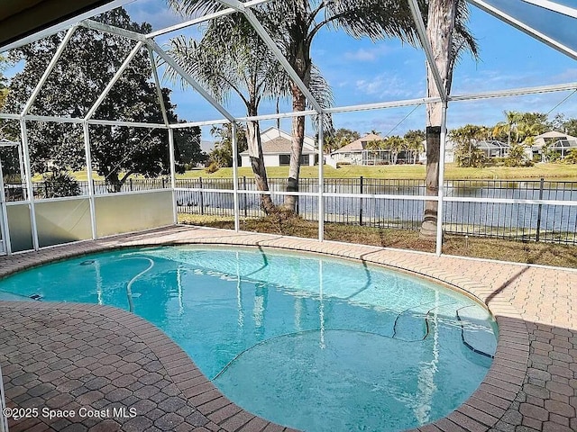 view of swimming pool with glass enclosure