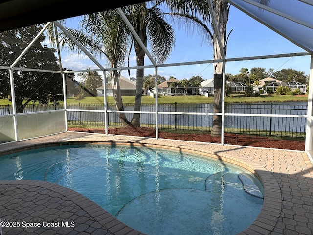 view of pool with a water view and a lanai