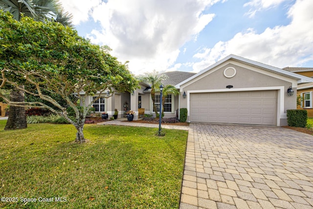 view of front of house featuring a garage and a front lawn