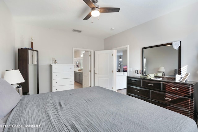 bedroom with ensuite bathroom and ceiling fan