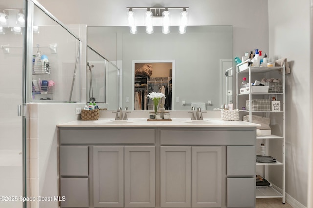 bathroom featuring vanity and an enclosed shower