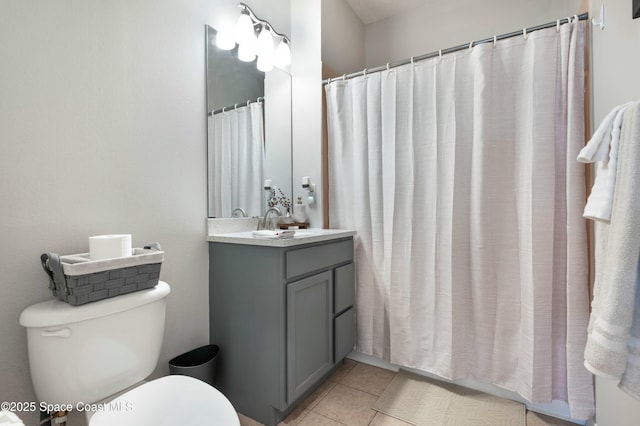 bathroom with a shower with shower curtain, vanity, toilet, and tile patterned flooring